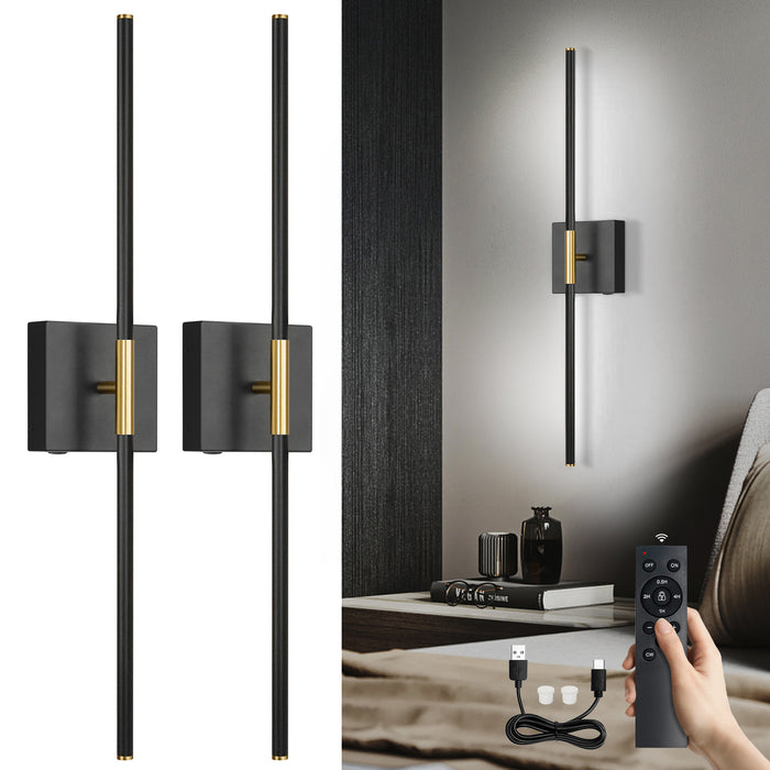 A pair of black battery operated wall sconces with gold accents.