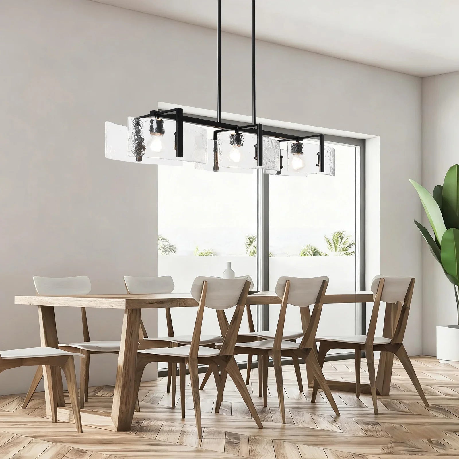 Dining room with wooden table and chairs, modern chandelier, and large window.