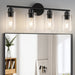 Modern black 4-lamp vanity bar with clear glass shades