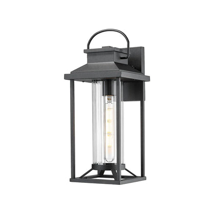 Black outdoor wall lantern with clear glass on a white background