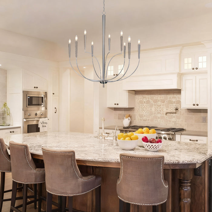 Modern kitchen with marble island, chandelier, and bar stools.