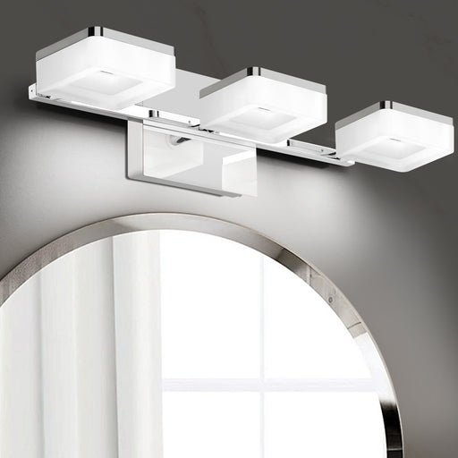 Modern LED bathroom vanity light fixture with a chrome finish and bubble crystal design, mounted on a wall above a mirror.