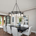 Modern dining room with a chandelier.