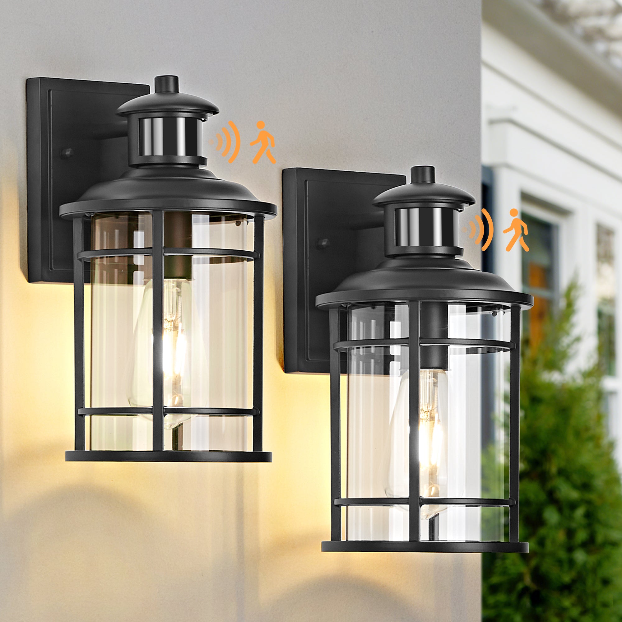Two black outdoor wall lights on a building exterior.