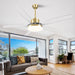 A modern smart ceiling fan with clear blades and a gold reversible dimmable LED light, displayed in a living room setting.